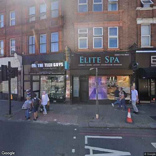 Shopfronts with flats above on a Camden high street